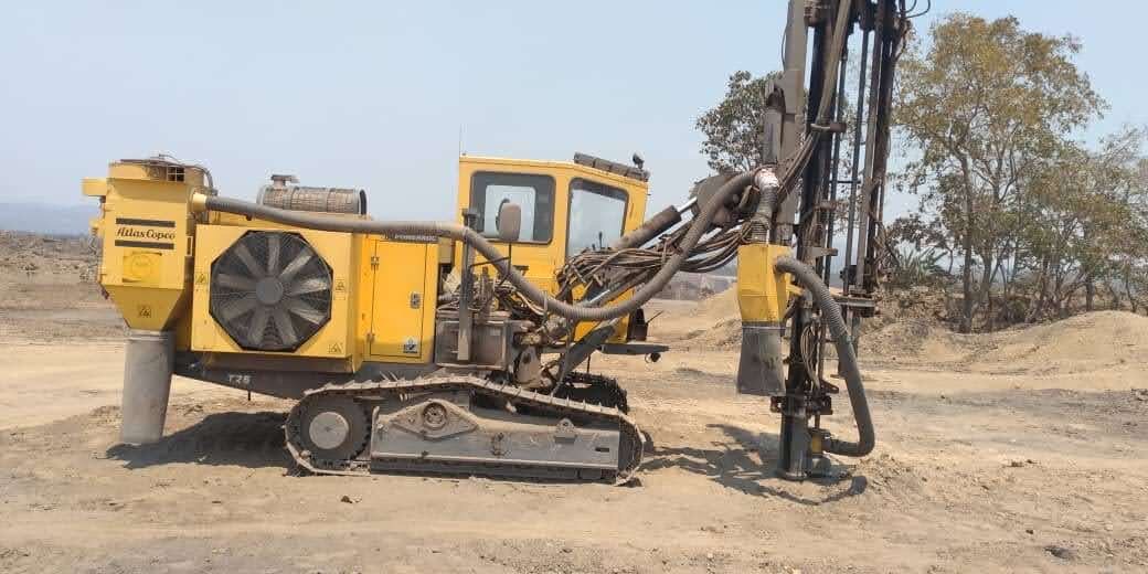 NAM drilling rig operating on an open site